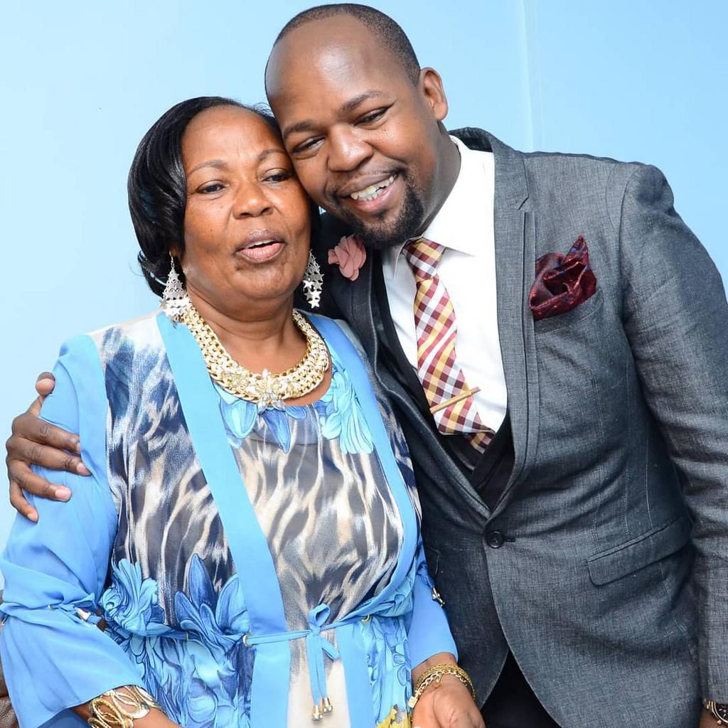 Alex Mwakideu with his mother