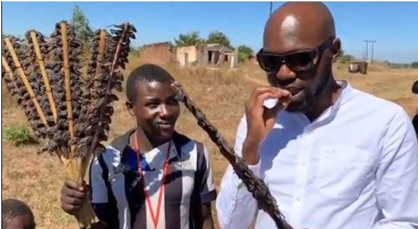 Larry Madowo eating Mouse