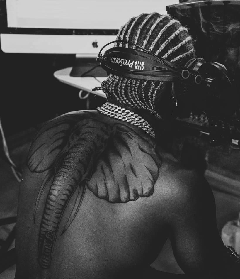 Harmonize gets huge elephant tattoo on his back and fans can’t keep calm (Photos)