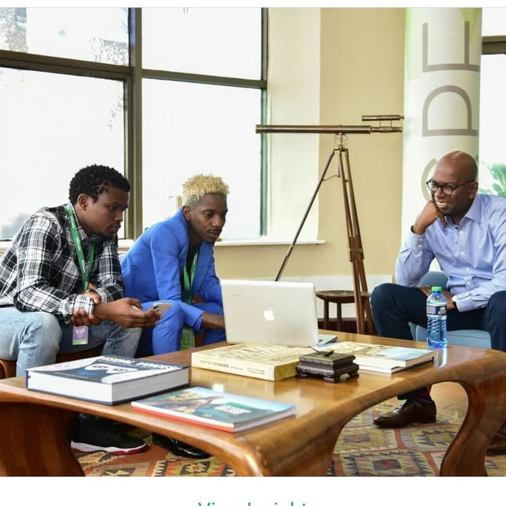 Eric Omondi with the late  Safaricom CEO Bob Collymore