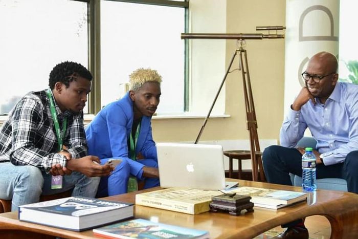 Eric Omondi with the late  Safaricom CEO Bob Collymore