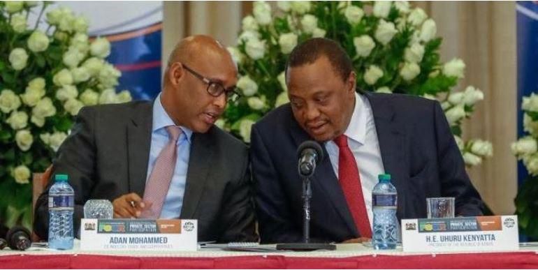 File image of President Uhuru Kenyatta (left) with East African Community Cabinet Secretary Adan Mohamed