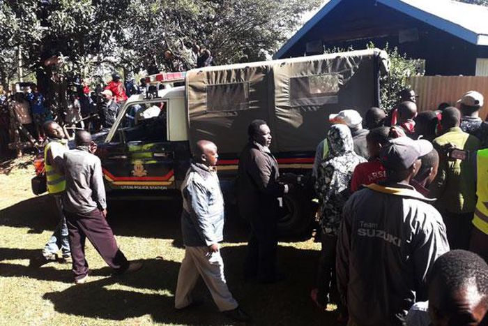 File image of Police Officers and members of the public at a scene of crime