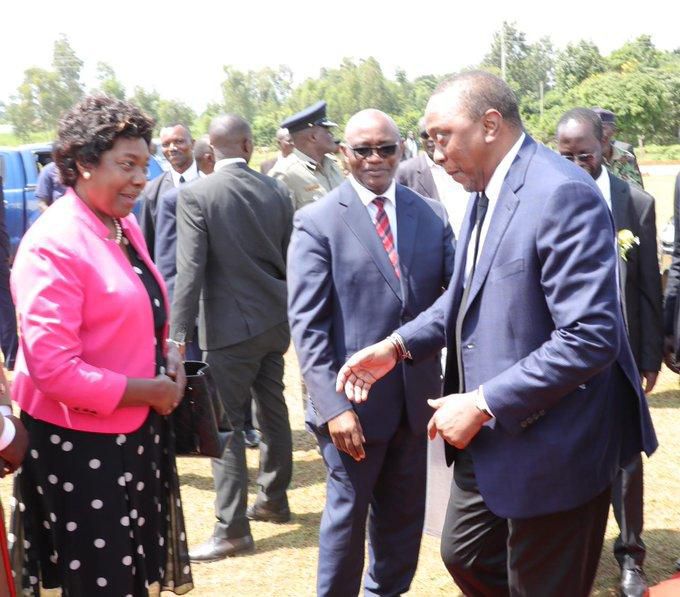 President Uhuru Kenyatta making faces while greeting Governor Charity Ngilu