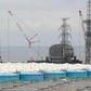 Removing fuel rods, Japan hits milestone in Fukushima nuclear cleanup