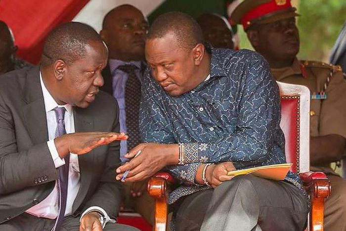 File image of CS Fred Matiang’i with President Uhuru Kenyatta
