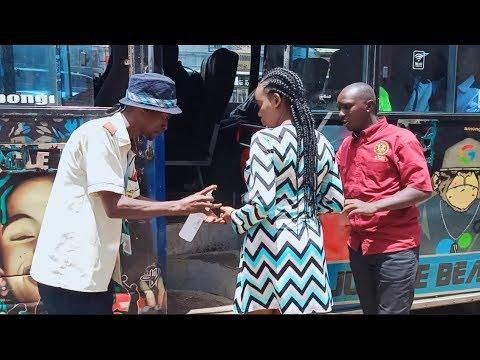 Passengers sanitizing hands before boarding matatu