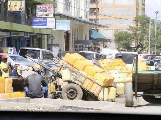 A water vendor delivering water in his cart