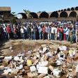 File image of members of the public destroying illegal liquor