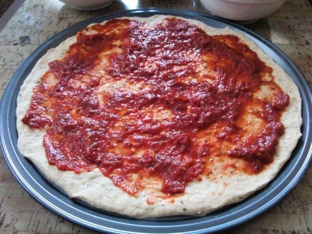 Recipe with a Pulselive twist: Pizza dough with pizza sauce base before adding toppings