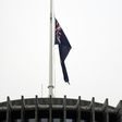 The New Zealand flag hangs at half mast outside the parliament building in Wellington on Tuesday following last week's mosque massacre