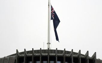 The New Zealand flag hangs at half mast outside the parliament building in Wellington on Tuesday following last week's mosque massacre