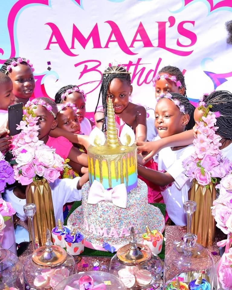 Amaal cutting the cake