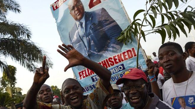 Supporters of DR Congo's opposition presidential candidate Felix Tshisekedi rally outside his party headquarters in Limete