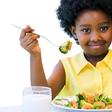 Little girl eating healthy