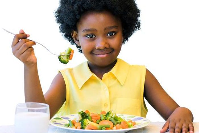 Little girl eating healthy