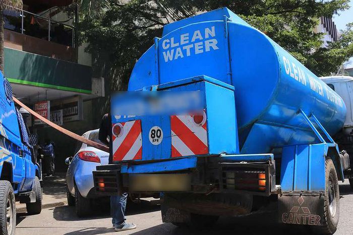 A water bowser delivers water in the city centre