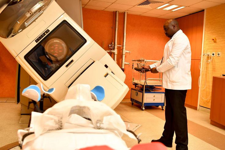 A specialist using a radiology machine