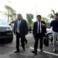 Premchai Karnasuta (left), who is charged with a slew of offences related to poaching, arrives at court to hear the verdict