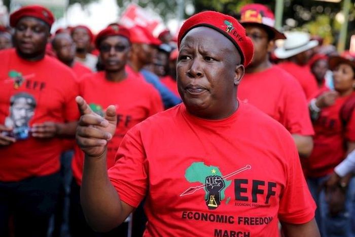 Leader of South Africa's left-wing Economic Freedom Fighters (EFF) Julius Malema gestures after arriving at the Johannesburg Stock Exchange (JSE) in Sandton, October 27, 2015. REUTERS/Siphiwe Sibeko