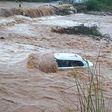 Vehicle swept away by floods