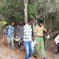 Officers carry away an unidentified body