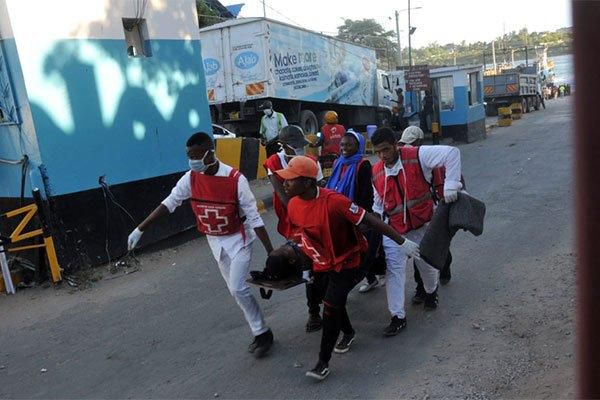 Red Cross carry an injured person after stampede at the Likoni Channel. Kenyans forced to stand 1 metre apart on ferry, waiting bay at Likoni after stampede