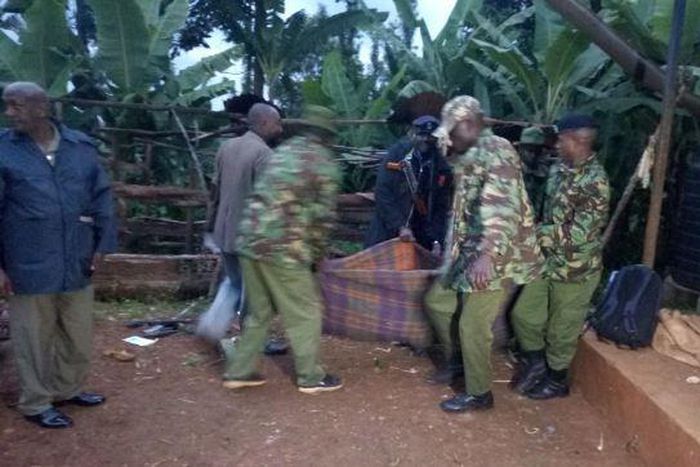 Police carry away a dead body during a past incident (Twitter)