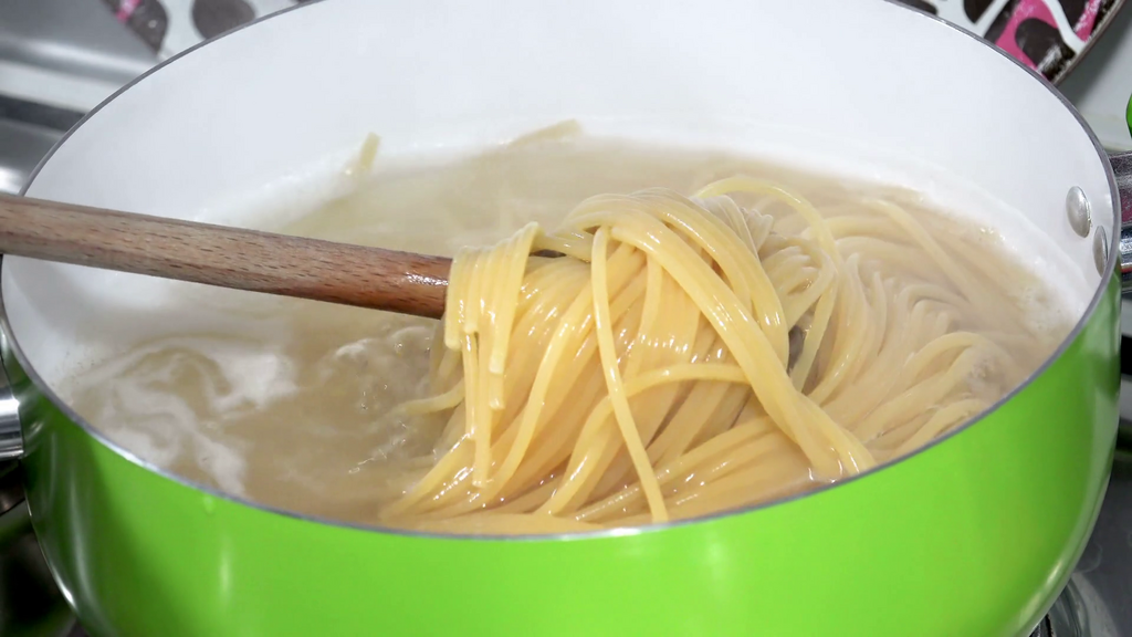Stirring pasta(Video Blocks)