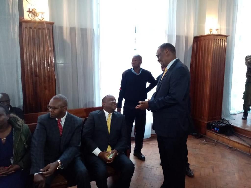 Former Nairobi Governor Evans Kidero consoles Treasury CS Henry Rotich