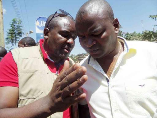 File image of Stanley Livondo (L) with former Sprts CS Rashid Echesa