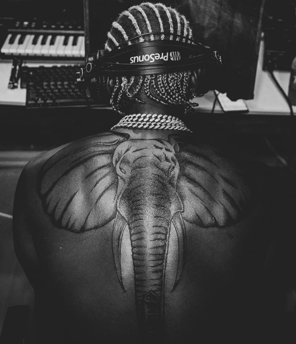 Harmonize gets huge elephant tattoo on his back and fans can’t keep calm (Photos)