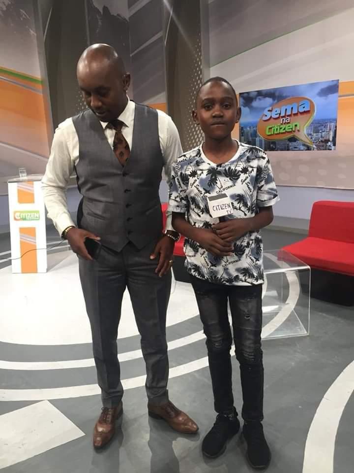 Journalist Nimrod Taabu with student Levis Saule