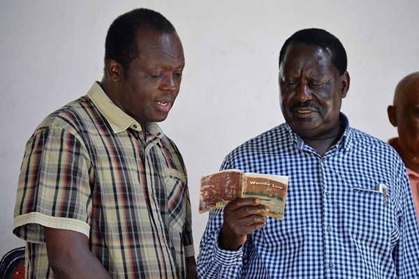 Jubilee Party Secretary-General Raphael Tuju (left) and ODM leader Raila Odinga