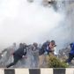 File image of police using teargas canisters to disperse rowdy crowds at a past political event. Police moved in swiftly to disperse rowdy youths who attempted to disrupt a Team Embrace ally in Garissa on Saturday