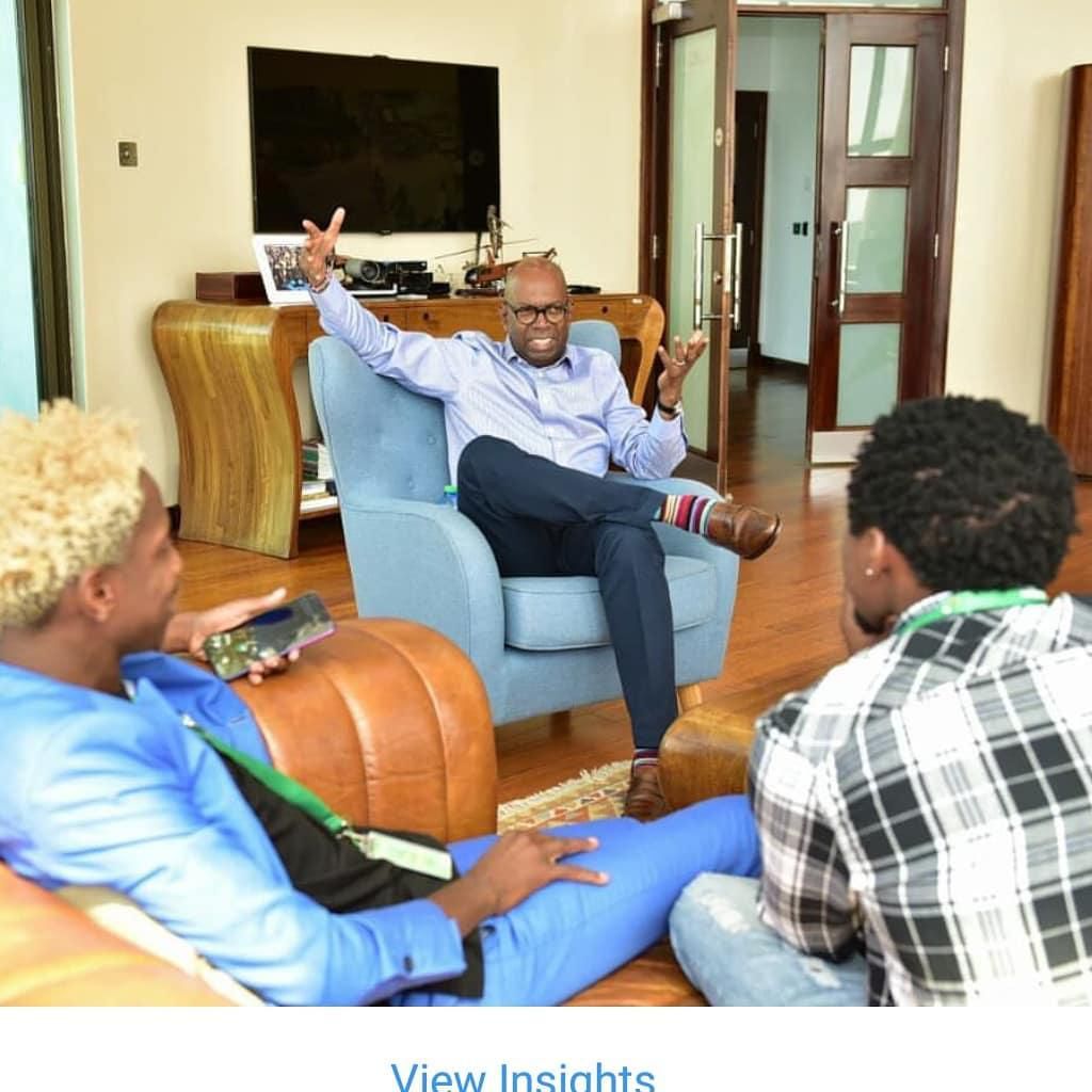 Eric Omondi with the late  Safaricom CEO Bob Collymore