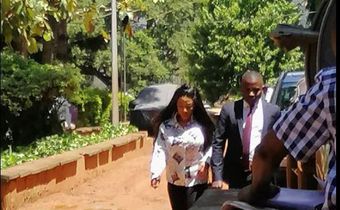 Bad Black flanked by one of her lawyers