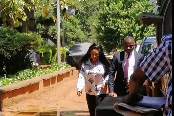 Bad Black flanked by one of her lawyers