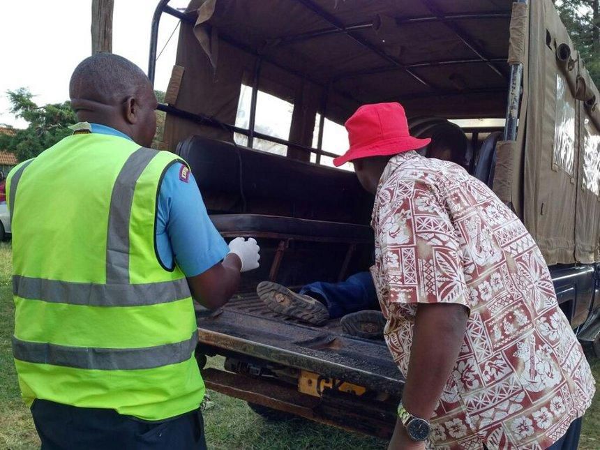 File image of police officers ferrying a dead body.