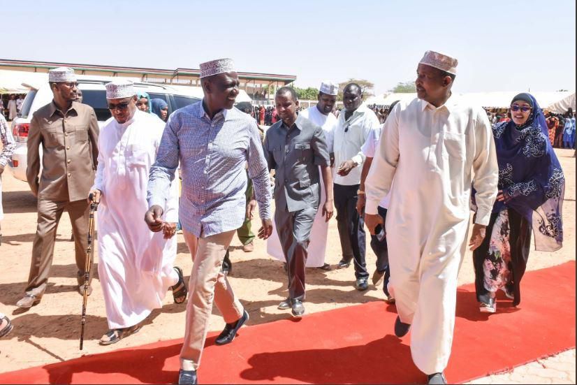 Aden Duale with DP Ruto in Mandera where they flagged off relief food supplies on Saturday