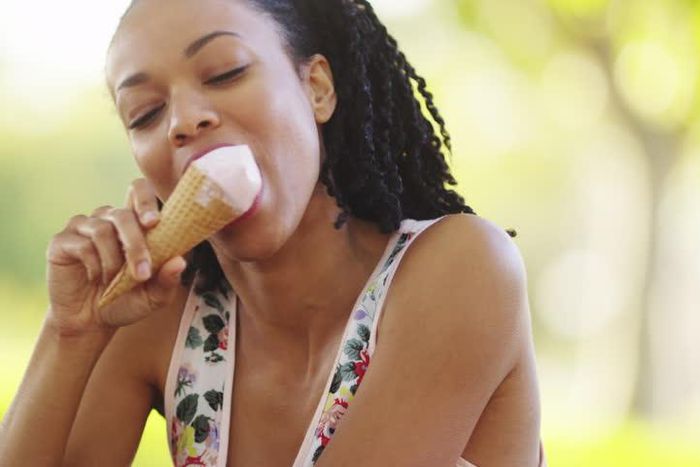 Woman enjoying ice-cream (Shutterstock)