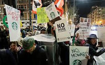 Schultz draws protesters in his hometown, Seattle