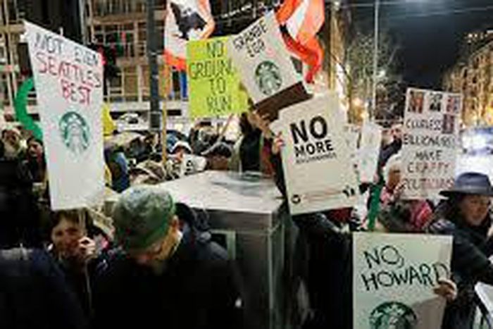 Schultz draws protesters in his hometown, Seattle