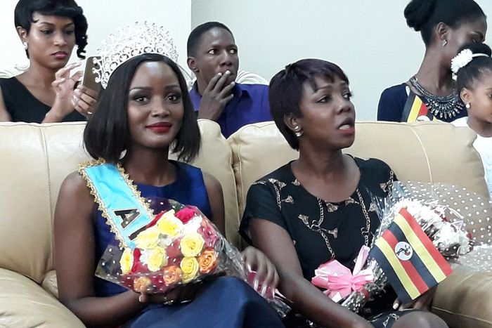 Miss Uganda Abenakyo sitting next toMiss Uganda Foundation CEO Brenda Nanyonjo shortly after arriving in Uganda