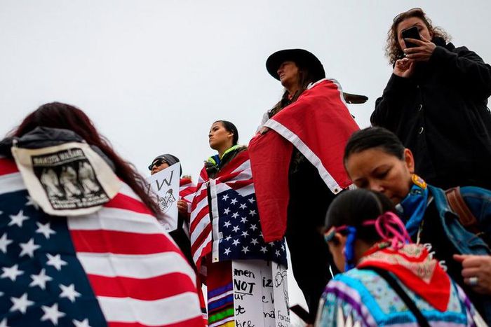 Boys in 'make America great again' hats mob native elder at indigenous peoples march