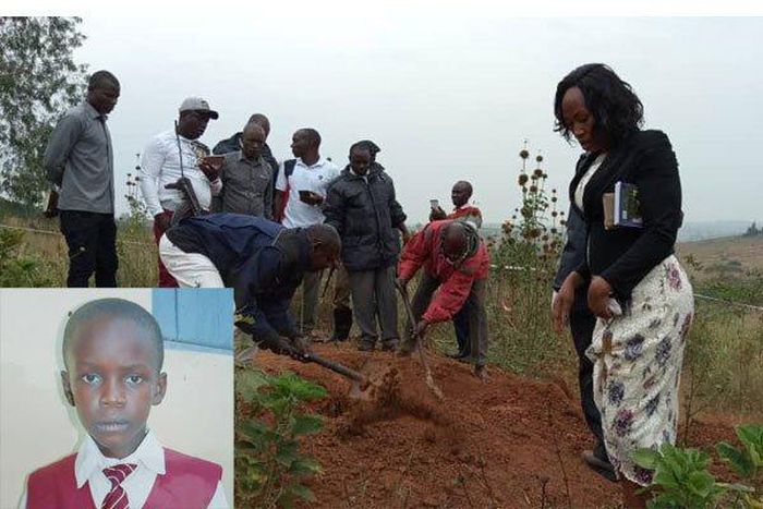 Police detectives exhume the body of 14-year-old Peter Oscar Muhairwe. (Photo by Monitor)