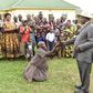 A woman kneels before Ugandan President Yoweri museveni during the recent Easter celebrations (Twitter)