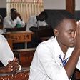 A student praying in an examination room