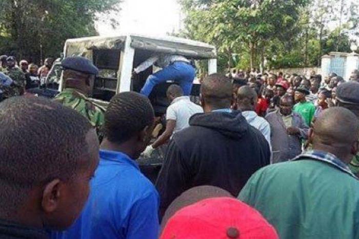 File image of police and on-lookers at a past crime scene