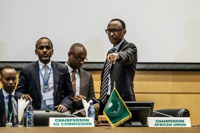 African Union chairperson and Rwanda's President Paul Kagame (R) gestures at the beginning of an African Union High Level Consultation Meeting with African leaders regarding the DR Congo election